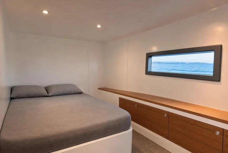 Boat interior liner in a yacht guest cabin: white FRP gelcoat sheet on the hull side